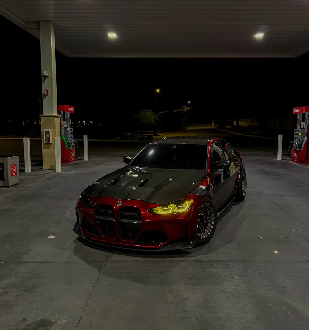 PSI Garage shop car: red BMW M3 with carbon hood and a single headlight delete
