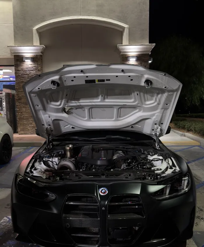 BMW with the hood open
